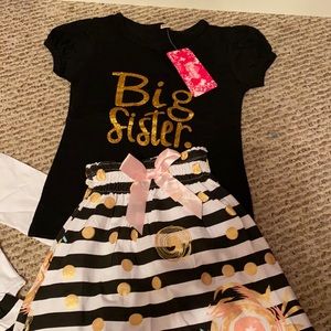 Big sister/little sister outfits.